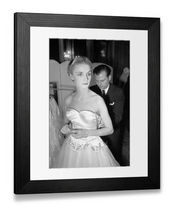 Framed Print : Zip Me Up. 28th February 1953: Backstage a British model having her dress Framed Print : Zip Me Up. 28th February 1953: Backstage a British model having her dress