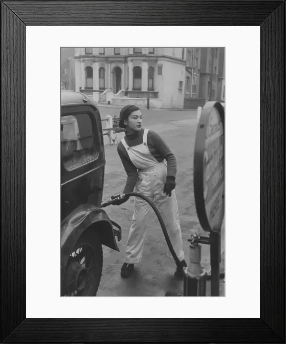 Framed Print : Pump Girl. 1st November 1952: A female pump attendant or petrol popsy at Framed Print : Pump Girl. 1st November 1952: A female pump attendant or petrol popsy at