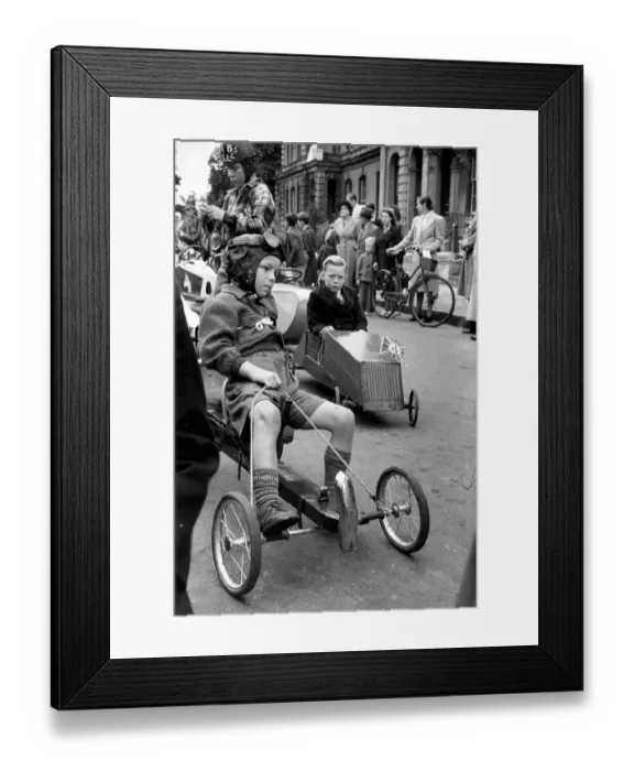 Framed Print : Mini Prix. An assortment of vehicles cruise into Leighton Buzzard as young Framed Print : Mini Prix. An assortment of vehicles cruise into Leighton Buzzard as young