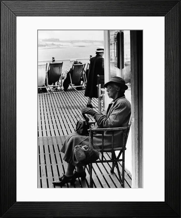 Framed Print : Pier Rest. June 1952: A woman resting on Brighton Palace Pier Framed Print : Pier Rest. June 1952: A woman resting on Brighton Palace Pier