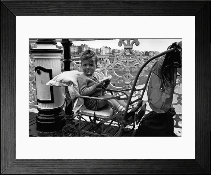 Framed Print : Ice Cream. June 1952: A toddler at Brighton enjoys an ice cream in his pram Framed Print : Ice Cream. June 1952: A toddler at Brighton enjoys an ice cream in his pram
