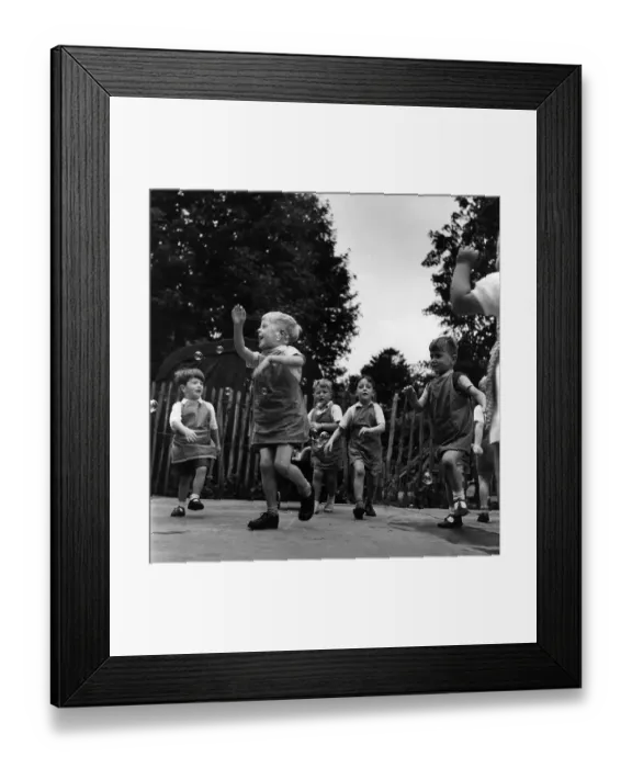 Framed Print : Playtime. 1952: Nursery schoolchildren play in the playground Framed Print : Playtime. 1952: Nursery schoolchildren play in the playground