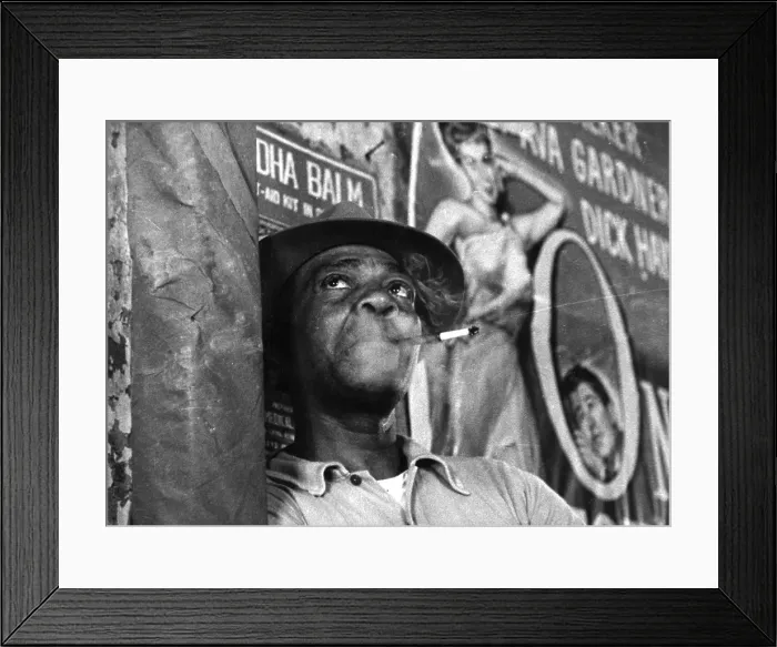 Framed Print : Caribbean. 1952: A man leans against a wall in the Crown Film Unit production Caribbean Framed Print : Caribbean. 1952: A man leans against a wall in the Crown Film Unit production Caribbean