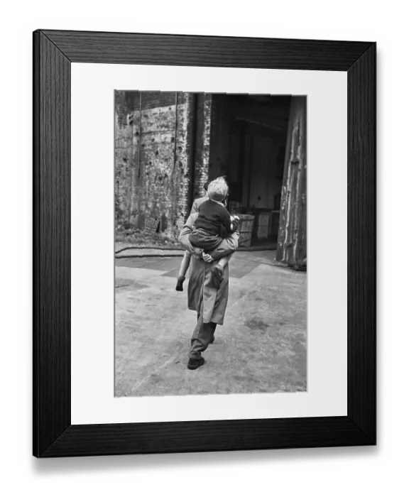 Framed Print : Hunted. English actor, Dirk Bogarde carries Scottish child actor Framed Print : Hunted. English actor, Dirk Bogarde carries Scottish child actor