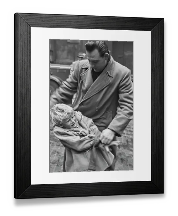 Framed Print : Hunted. Scottish child actor Jon Whiteley is restrained by a man while Framed Print : Hunted. Scottish child actor Jon Whiteley is restrained by a man while