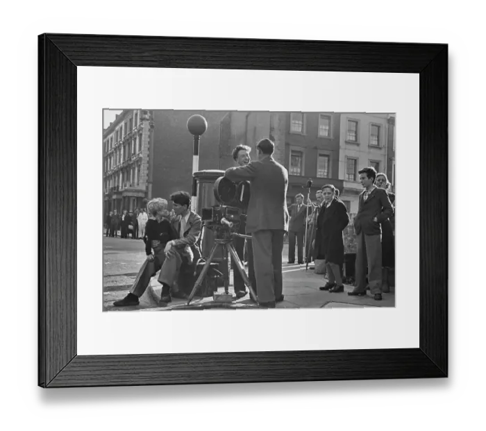 Framed Print : Hunted. Scottish child actor Jon Whiteley sits on the knee of a man during Framed Print : Hunted. Scottish child actor Jon Whiteley sits on the knee of a man during