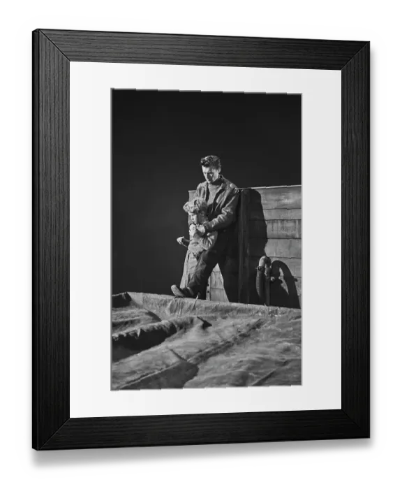 Framed Print : Hunted. Scottish child actor Jon Whiteley is held by a man on set during Framed Print : Hunted. Scottish child actor Jon Whiteley is held by a man on set during