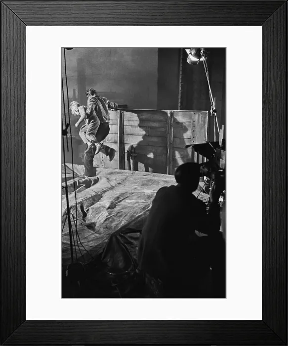 Framed Print : Hunted. Scottish child actor Jon Whiteley is carried by a man on set during Framed Print : Hunted. Scottish child actor Jon Whiteley is carried by a man on set during
