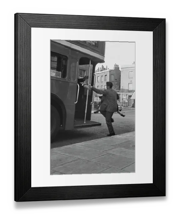 Framed Print : Hunted. Scottish child actor Jon Whiteley is carried onto a bus during Framed Print : Hunted. Scottish child actor Jon Whiteley is carried onto a bus during