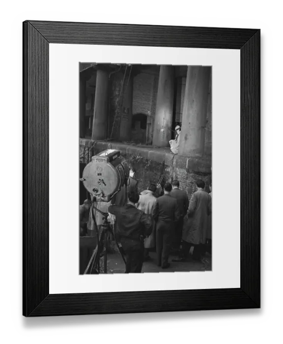 Framed Print : Hunted. Film crew members watching English actor Dirk Bogarde Framed Print : Hunted. Film crew members watching English actor Dirk Bogarde