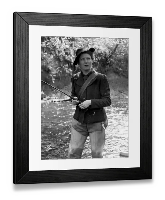 Framed Print : Fishing. 1951: A woman fishing in a river Framed Print : Fishing. 1951: A woman fishing in a river