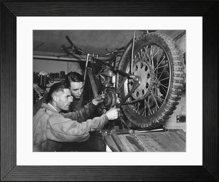 Framed Print : Tuning Up. 23rd September 1950: Motorcycle racer Tommy Price tinkering with his engine Framed Print : Tuning Up. 23rd September 1950: Motorcycle racer Tommy Price tinkering with his engine