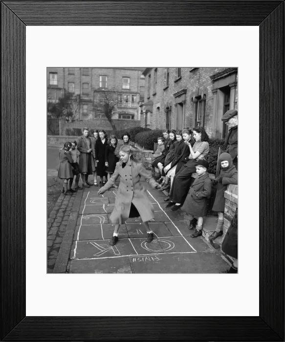 Framed Print : Hopscotch. A group of children playing a game of hopscotch in a London street, April 1950 Framed Print : Hopscotch. A group of children playing a game of hopscotch in a London street, April 1950