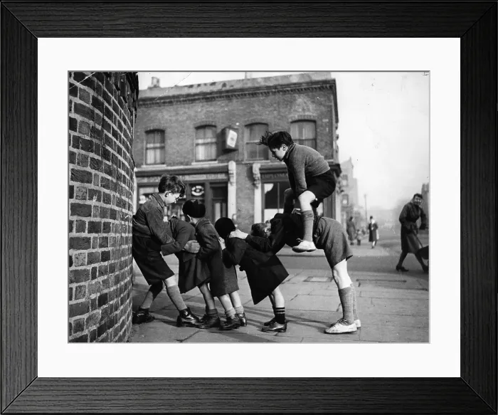 Framed Print : Leap-Frog. Children playing games in the street Framed Print : Leap-Frog. Children playing games in the street