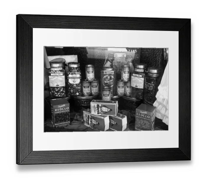 Framed Print : Goodies. circa 1950: Some of the goods on sale in a confectioners shop include Framed Print : Goodies. circa 1950: Some of the goods on sale in a confectioners shop include