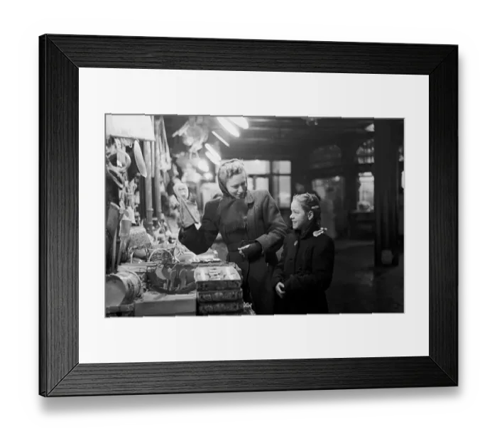 Framed Print : Toy Stall. 5th February 1949: A young customer talking to Mrs Green of Reed's Toys Framed Print : Toy Stall. 5th February 1949: A young customer talking to Mrs Green of Reed's Toys