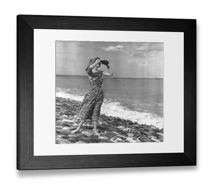 Framed Print : A Seaview. 24th July 1948: A woman looking out to sea with binoculars Framed Print : A Seaview. 24th July 1948: A woman looking out to sea with binoculars