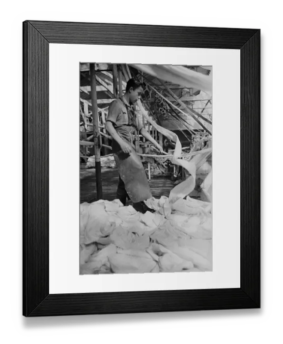 Framed Print : Linen. 3rd July 1948: Linen piling up round the feet of a worker in an Irish linen factory Framed Print : Linen. 3rd July 1948: Linen piling up round the feet of a worker in an Irish linen factory