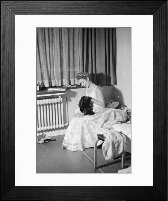 Framed Print : Sewing. 17th January 1948: A young woman doing some sewing in her room in a Cecil House Framed Print : Sewing. 17th January 1948: A young woman doing some sewing in her room in a Cecil House