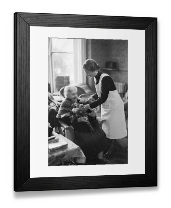 Framed Print : Nursing. 20th December 1947: A Salvation Army volunteer nurses an old woman Framed Print : Nursing. 20th December 1947: A Salvation Army volunteer nurses an old woman