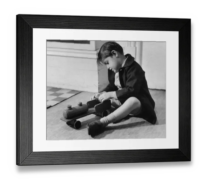 Framed Print : Toy Train. 28th December 1946: A little boy playing with a wooden train Framed Print : Toy Train. 28th December 1946: A little boy playing with a wooden train