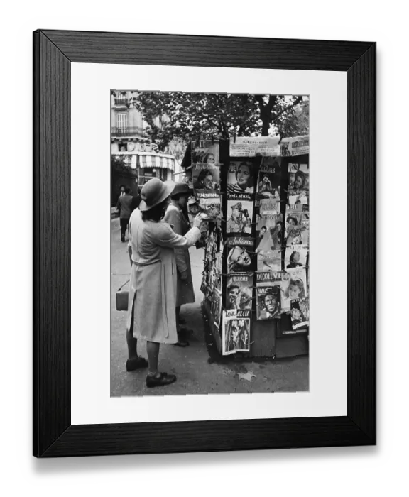 Framed Print : Revue. December 1946: British school girls looking at a rack of French magazines Framed Print : Revue. December 1946: British school girls looking at a rack of French magazines