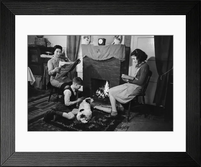 Framed Print : East End. 9th March 1946: A family sitting round the fire in a house in Framed Print : East End. 9th March 1946: A family sitting round the fire in a house in