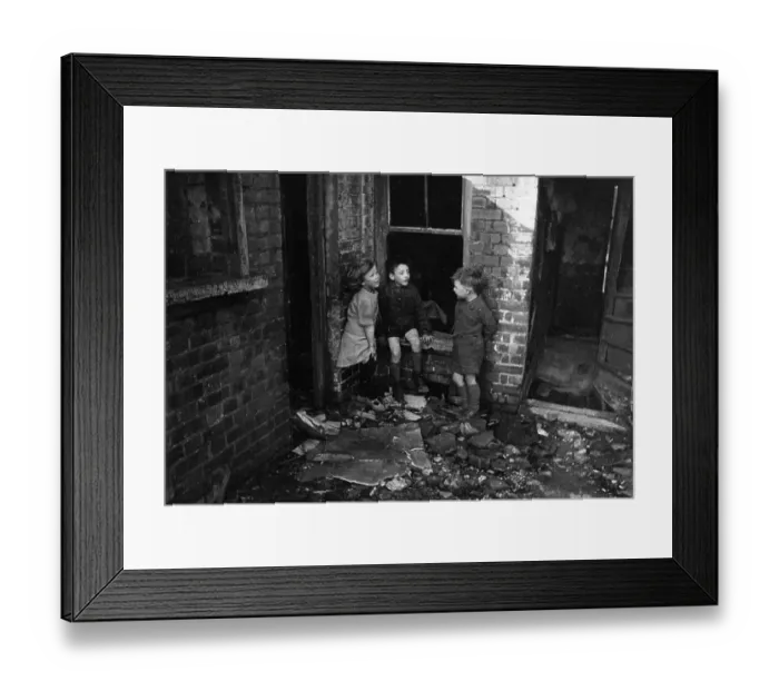 Framed Print : Bomb Site. 9th March 1946: Children play in the debris of a London bomb site Framed Print : Bomb Site. 9th March 1946: Children play in the debris of a London bomb site