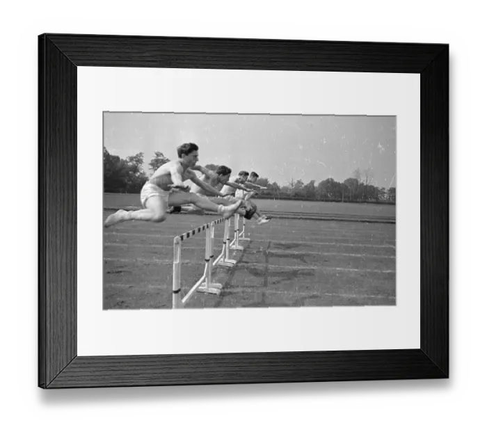 Framed Print : Hurdling. 14th July 1945: Students practicing in hurdle races at Loughborough College