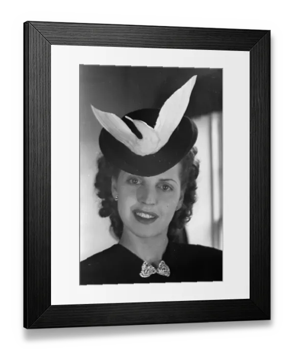 Framed Print : Dove Hat. A woman wearing a hat with a dove motif Framed Print : Dove Hat. A woman wearing a hat with a dove motif