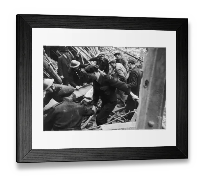 Framed Print : V2 Victim. An air raid casualty is stretchered away by rescue workers in Framed Print : V2 Victim. An air raid casualty is stretchered away by rescue workers in