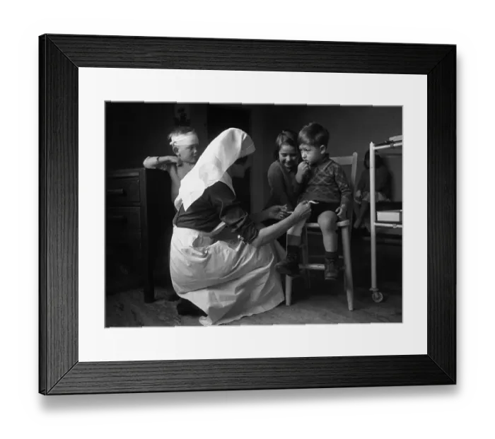Framed Print : First Aid. 29th July 1944: A children's nurse at a clinic at East Finchley