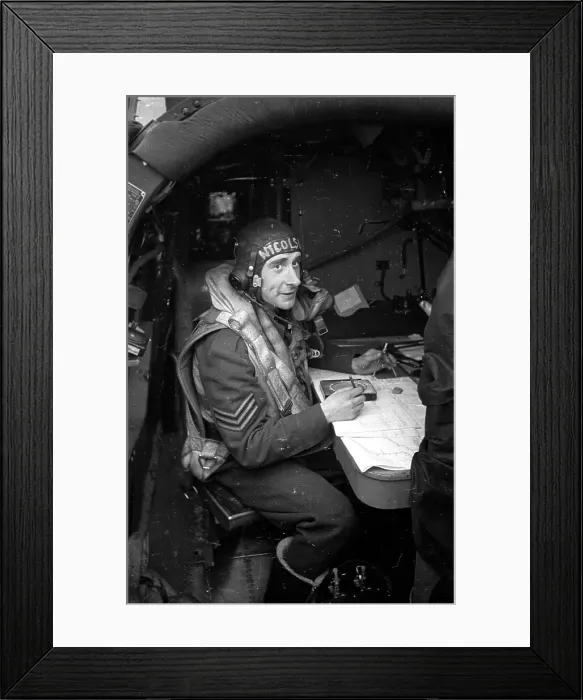 Framed Print : Navigator. 15th May 1943: On board a Lancaster bomber, the navigator plans his route