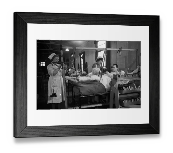 Framed Print : Leg Sling. 1st May 1943: A patient in a military hospital having his leg Framed Print : Leg Sling. 1st May 1943: A patient in a military hospital having his leg