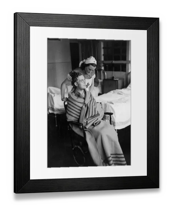 Framed Print : War Nurse. 22nd November 1941: A nurse tends a recovering soldier Framed Print : War Nurse. 22nd November 1941: A nurse tends a recovering soldier