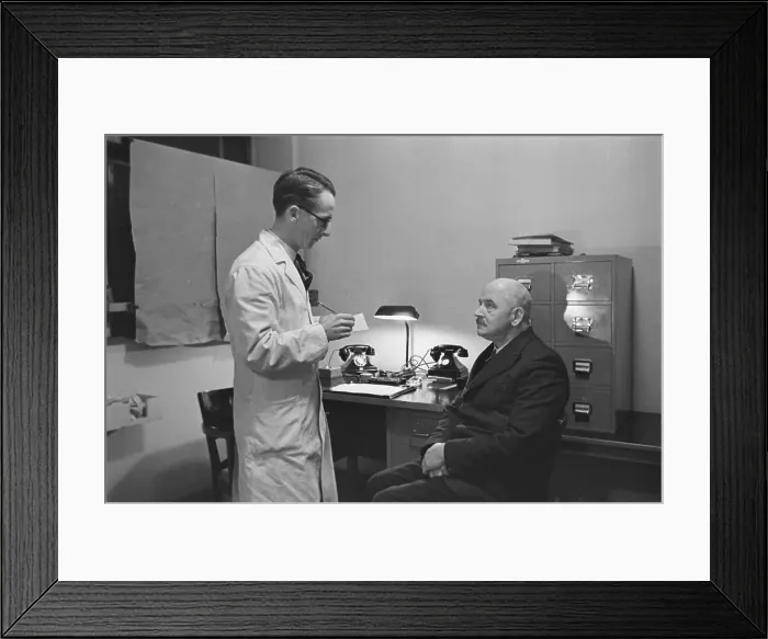Framed Print : Chiropodist And Patient