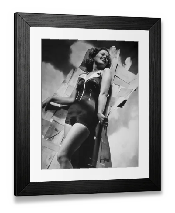 Framed Print : Swimwear. 18th May 1940: A black one-piece satin latex swimming costume Framed Print : Swimwear. 18th May 1940: A black one-piece satin latex swimming costume