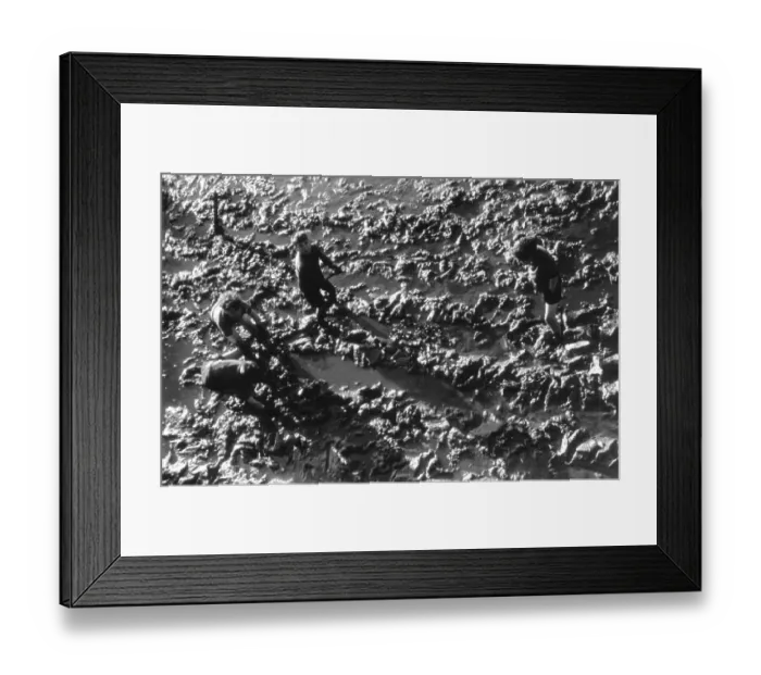 Framed Print : Mud Games. Children playing on mud flats in Portsmouth where large areas Framed Print : Mud Games. Children playing on mud flats in Portsmouth where large areas