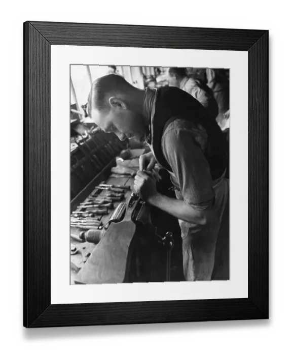 Framed Print : Gunmaking. 12th August 1939: A stocker fits the wood onto the action of Framed Print : Gunmaking. 12th August 1939: A stocker fits the wood onto the action of