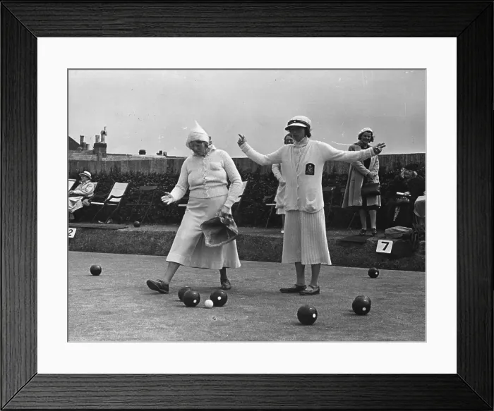 Framed Print : This Far!. 8th July 1939: Guessing the distance in a game of bowls Framed Print : This Far!. 8th July 1939: Guessing the distance in a game of bowls
