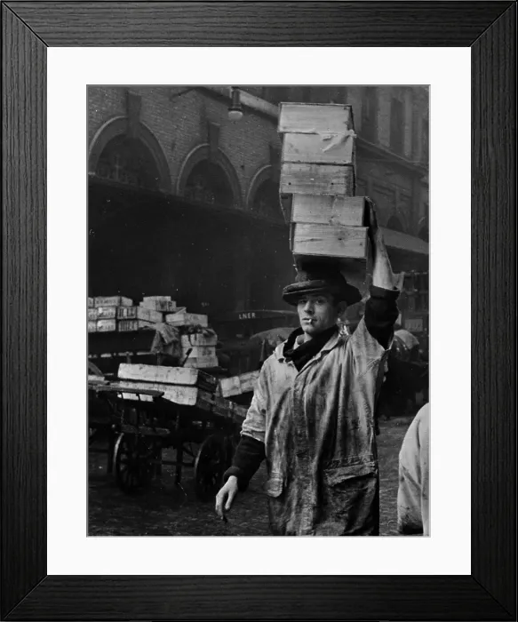 Framed Print : Fish Head. 22nd April 1939: A porter at Billingsgate fish market in London, carries a load Framed Print : Fish Head. 22nd April 1939: A porter at Billingsgate fish market in London, carries a load