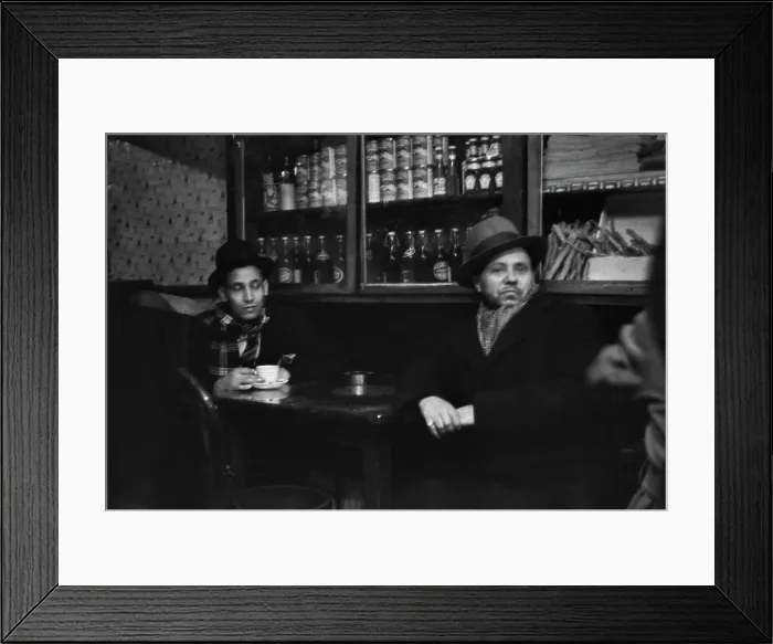 Framed Print : Cardiff. Two men sit at a table in a combined cafe and shop in Cardiff, 1939 Framed Print : Cardiff. Two men sit at a table in a combined cafe and shop in Cardiff, 1939