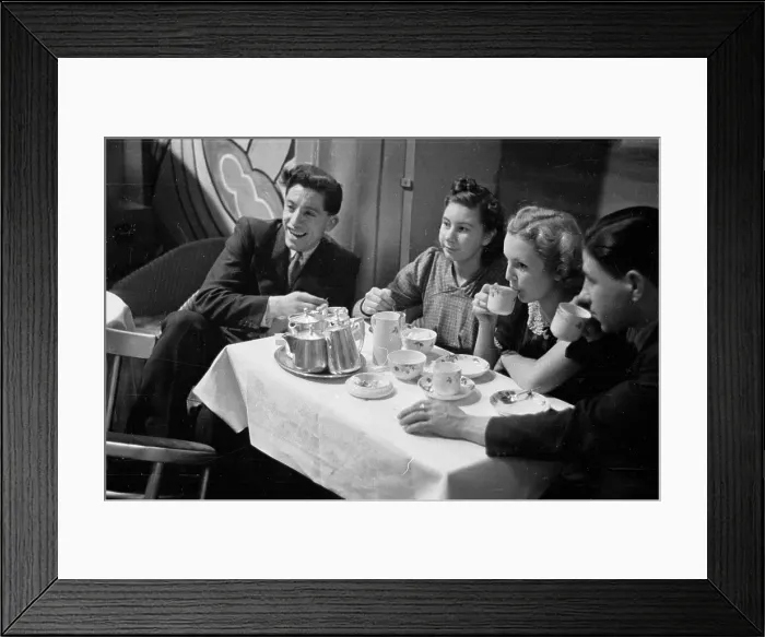 Framed Print : Tea Dance. 21st January 1939: Youngsters enjoy a pot of tea as they watch Framed Print : Tea Dance. 21st January 1939: Youngsters enjoy a pot of tea as they watch