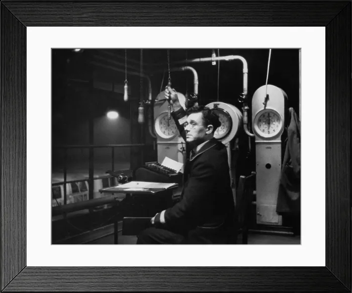 Framed Print : Bus Clerk. High up in the roof of a London Transport bus garage