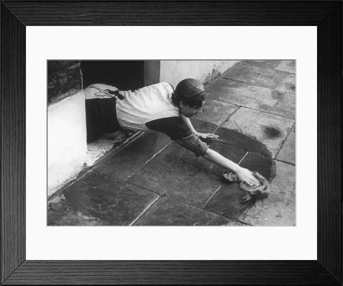 Framed Print : Cleaning A Doorstep Framed Print : Cleaning A Doorstep