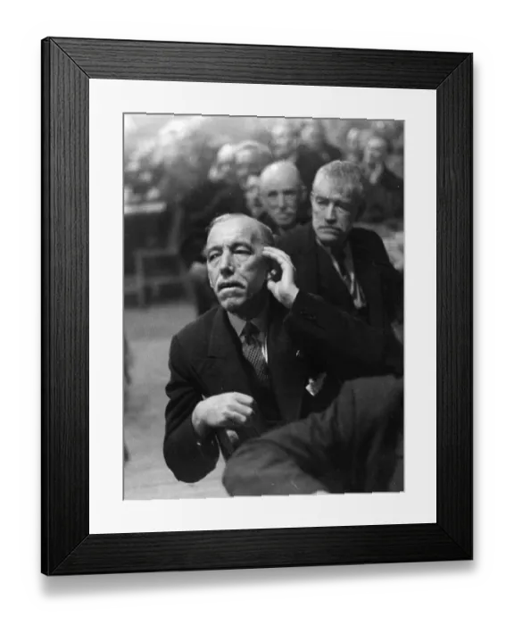 Framed Print : Speak Up. 24th December 1938: An elderly man cups his ear to hear what Framed Print : Speak Up. 24th December 1938: An elderly man cups his ear to hear what