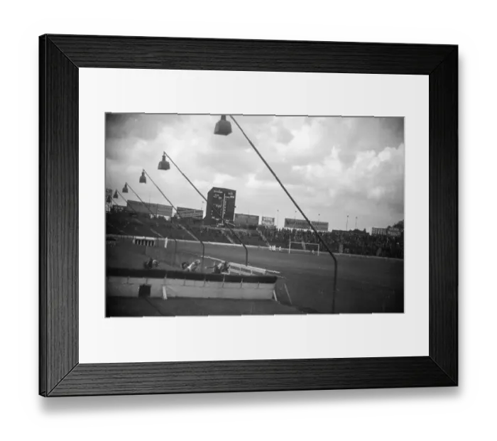 Framed Print : Racetrack. 15th October 1938: A greyhound race in progress at a racetrack Framed Print : Racetrack. 15th October 1938: A greyhound race in progress at a racetrack