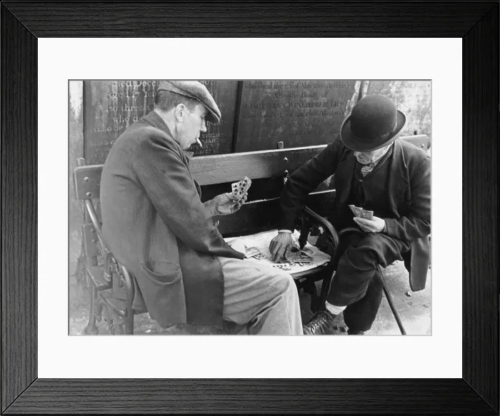 Framed Print : Card Game. 15th October 1938: Two old men playing cards in the graveyard