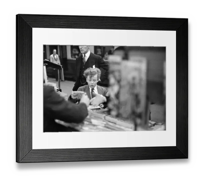 Framed Print : Paper Boy. 8th October 1938: A boy at a newspaper stand on a railway station Framed Print : Paper Boy. 8th October 1938: A boy at a newspaper stand on a railway station