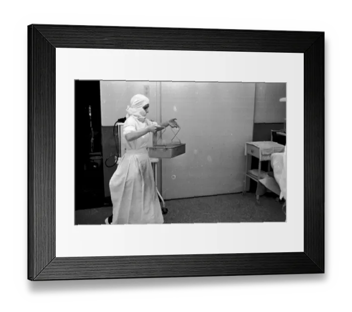 Framed Print : In Tray. 1st October 1938: A nurse brings sterile instruments into the Framed Print : In Tray. 1st October 1938: A nurse brings sterile instruments into the